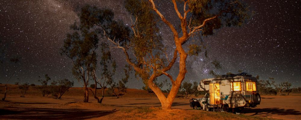 Camper van in the outback at night